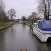 Railings on the left mark the Aqueduct. Moat, out of picture on the right, marks the remains of an old amusement park. Pub before the bridge on the right. by David Tunbridge – 19 February 2007