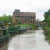 Arriving at Market Drayton with former cornmill and warehouse next to bridge by Stephen Squires – 28 April 2005