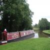 Odyssey is leaving the Whitchcurch arm, heading for Llangollen: the lift bridge on the main line is out of the picture to the right by PeterScott – 12 July 2004