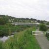 The footbridge provides easy access from the towpath to the adjacent Westerton railway station. by Bob Wood – 27 July 2004